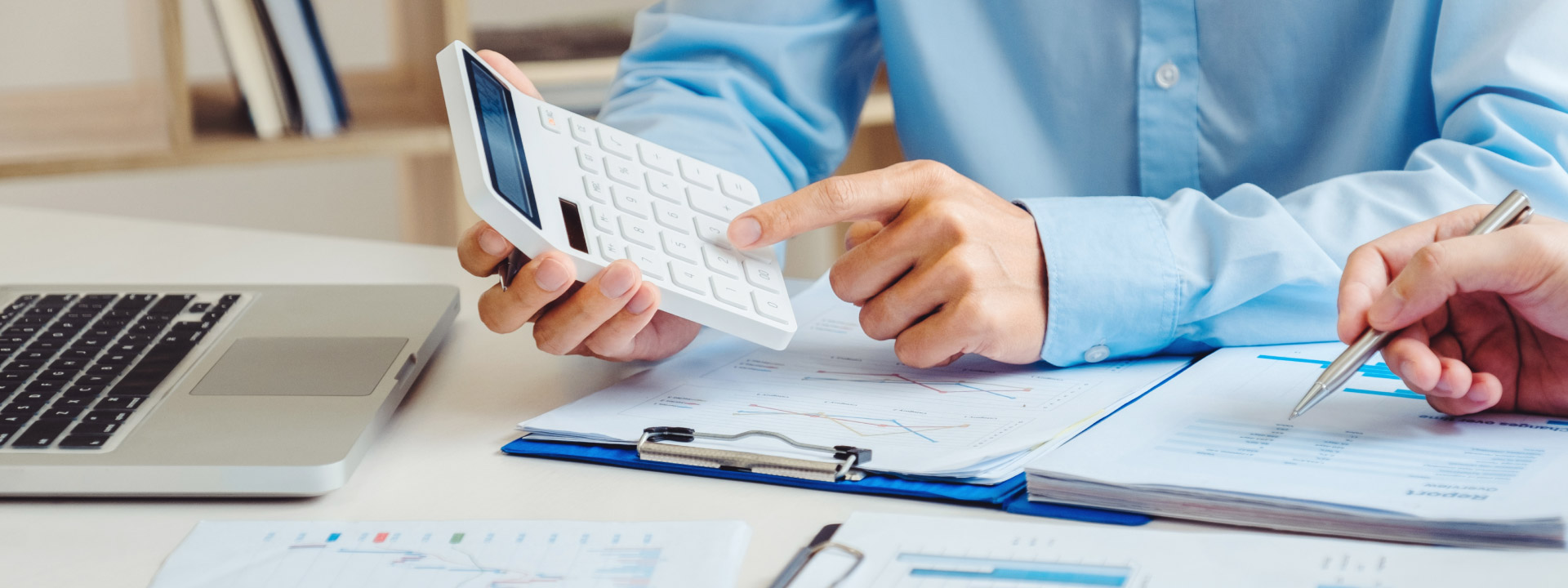 Man holding a calculator