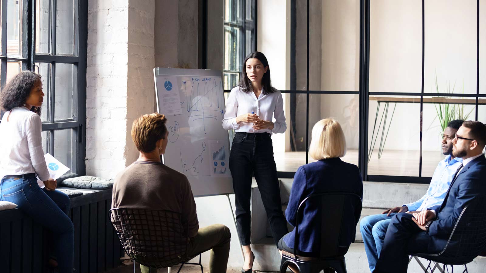 Woman leading meeting in an office.